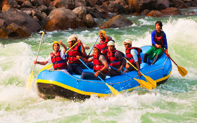 Professional rafting guide in Rishikesh with safety equipment